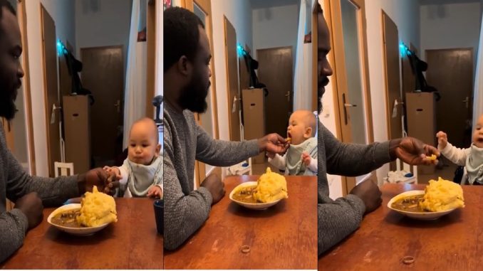 Netizens roar with laughter as white baby rushes dad in feeding him Nigerian food