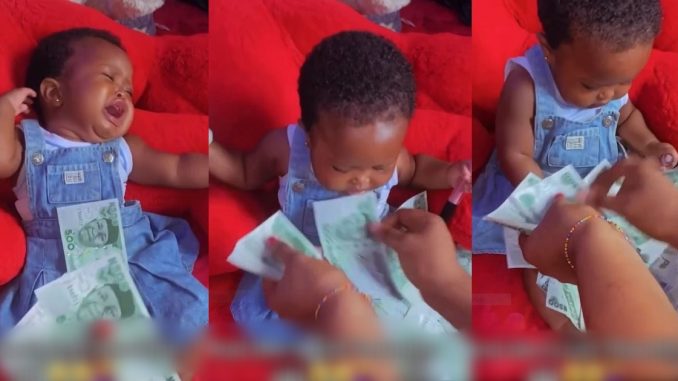 Moment Baby Stops Crying When Sprayed With Money Stirs Reactions Online (VIDEO)