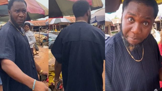 Nigerian Man Reduces His Steeze As He Follows His Wife To The Market, Claims She's Embezzl!ng His Money (WATCH)