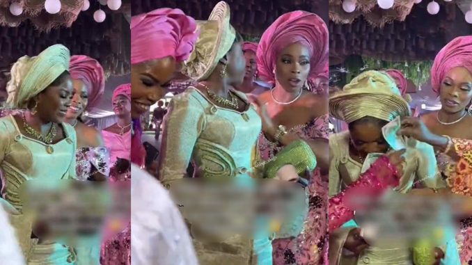 "She was protecting her makeup" – Aso-Ebi lady apologizes to bride after wrong assumption of the grandmother while spraying on the bride (VIDEO)