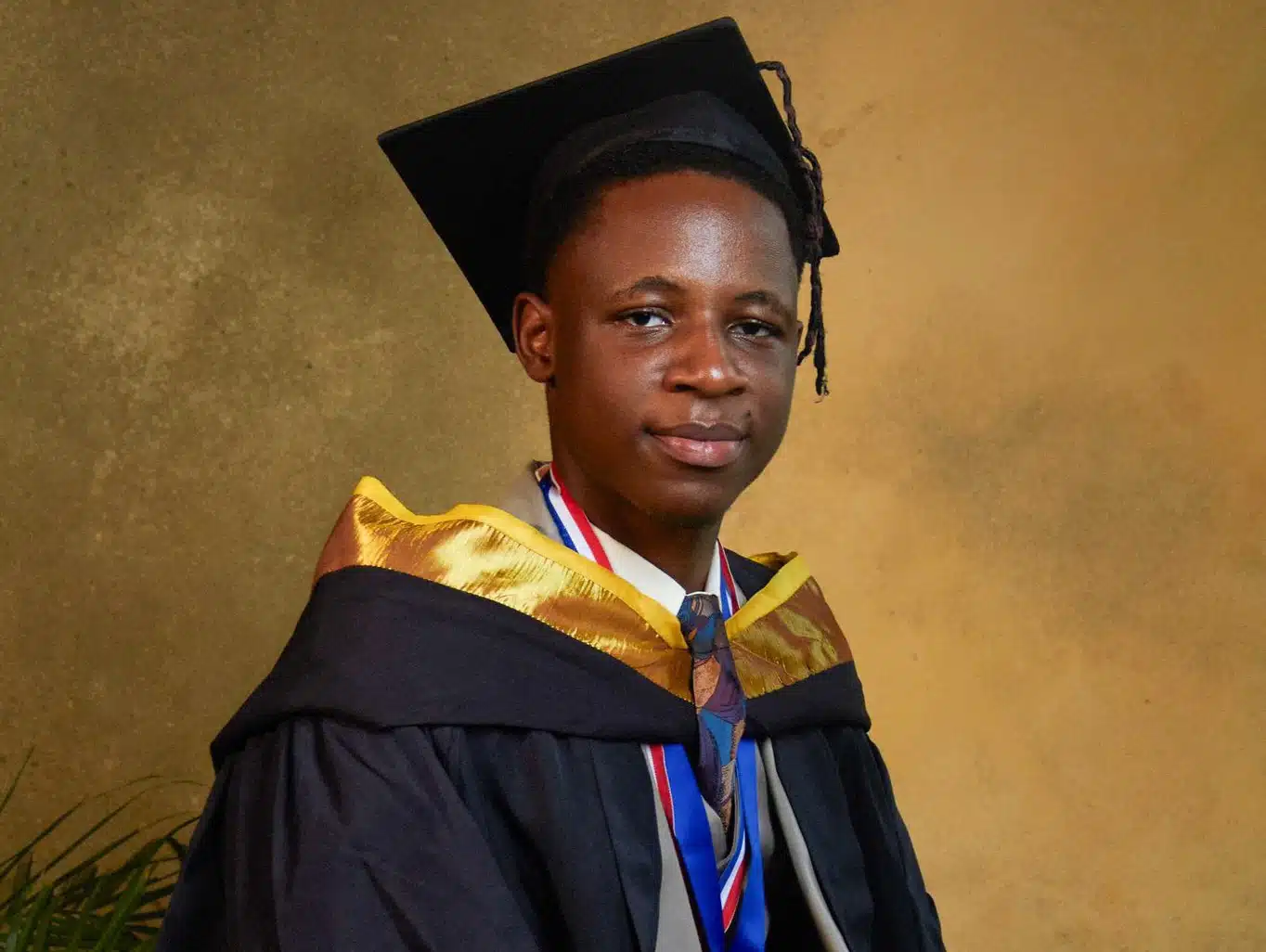 Man celebrates first-class degree from Babcock University, flaunts certificate and medal