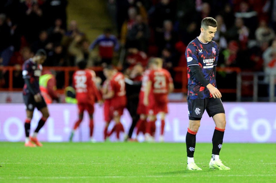 Rangers’ Tom Lawrence (right) looks frustrated as Morris celebrates