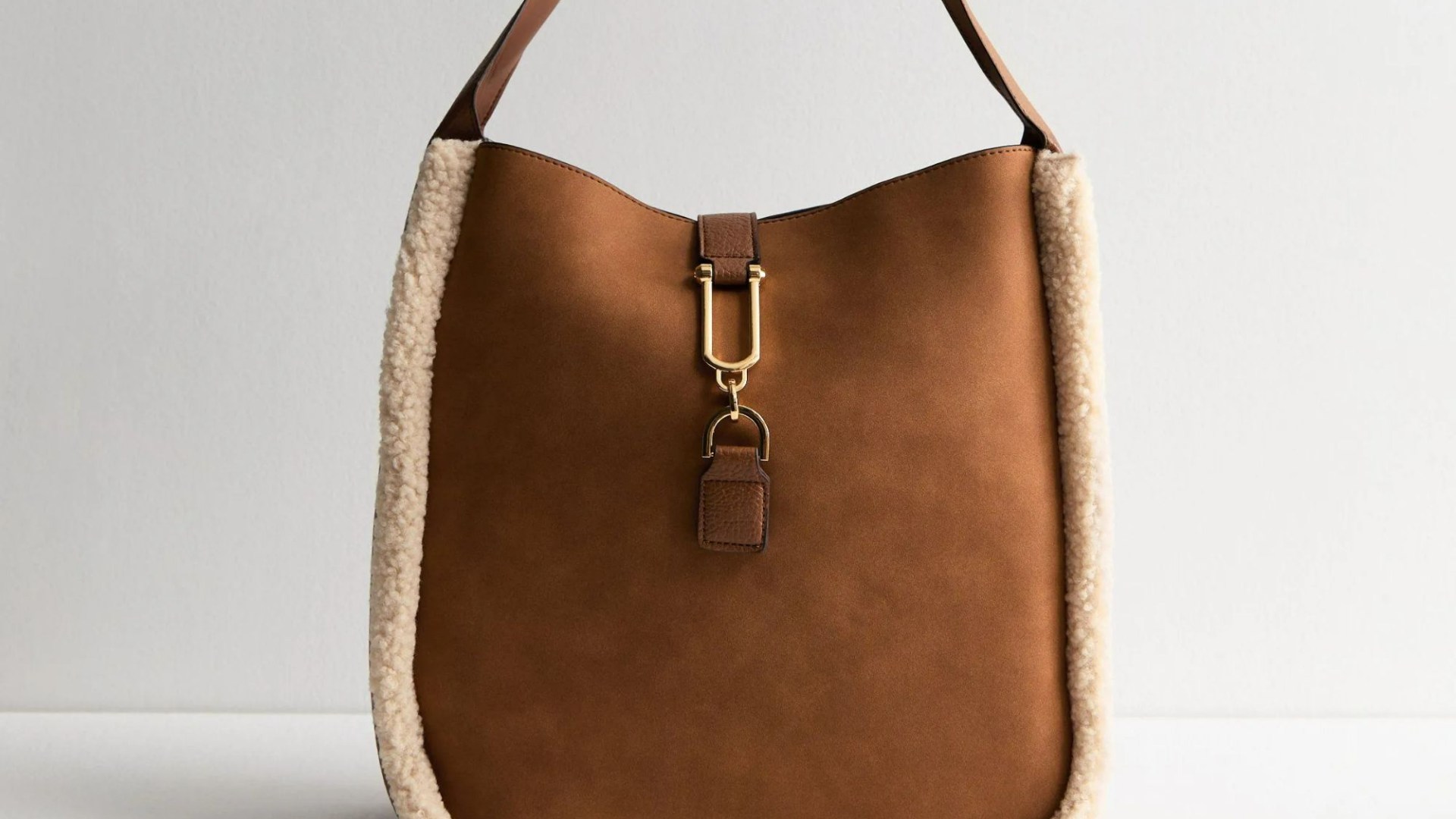 New Look’s £27.99 bag of the season is an almost exact copy for YSL’s suede version but £2k cheaper & has 5-star reviews