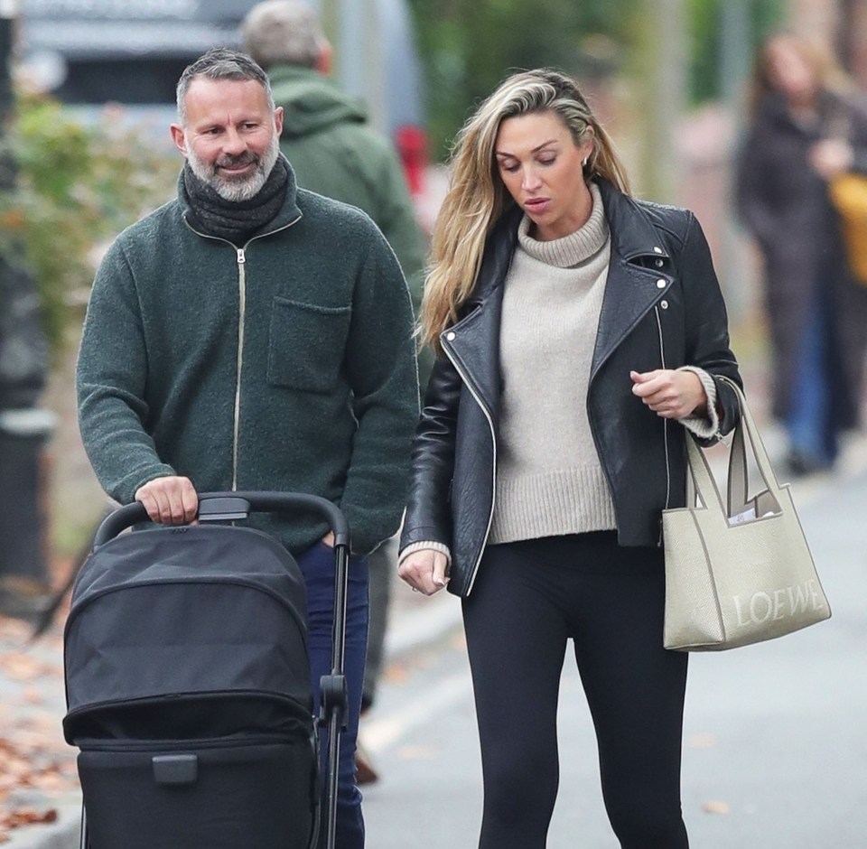 Ryan Giggs pushing his new baby girl in a pram alongside his girlfriend Zara Charles