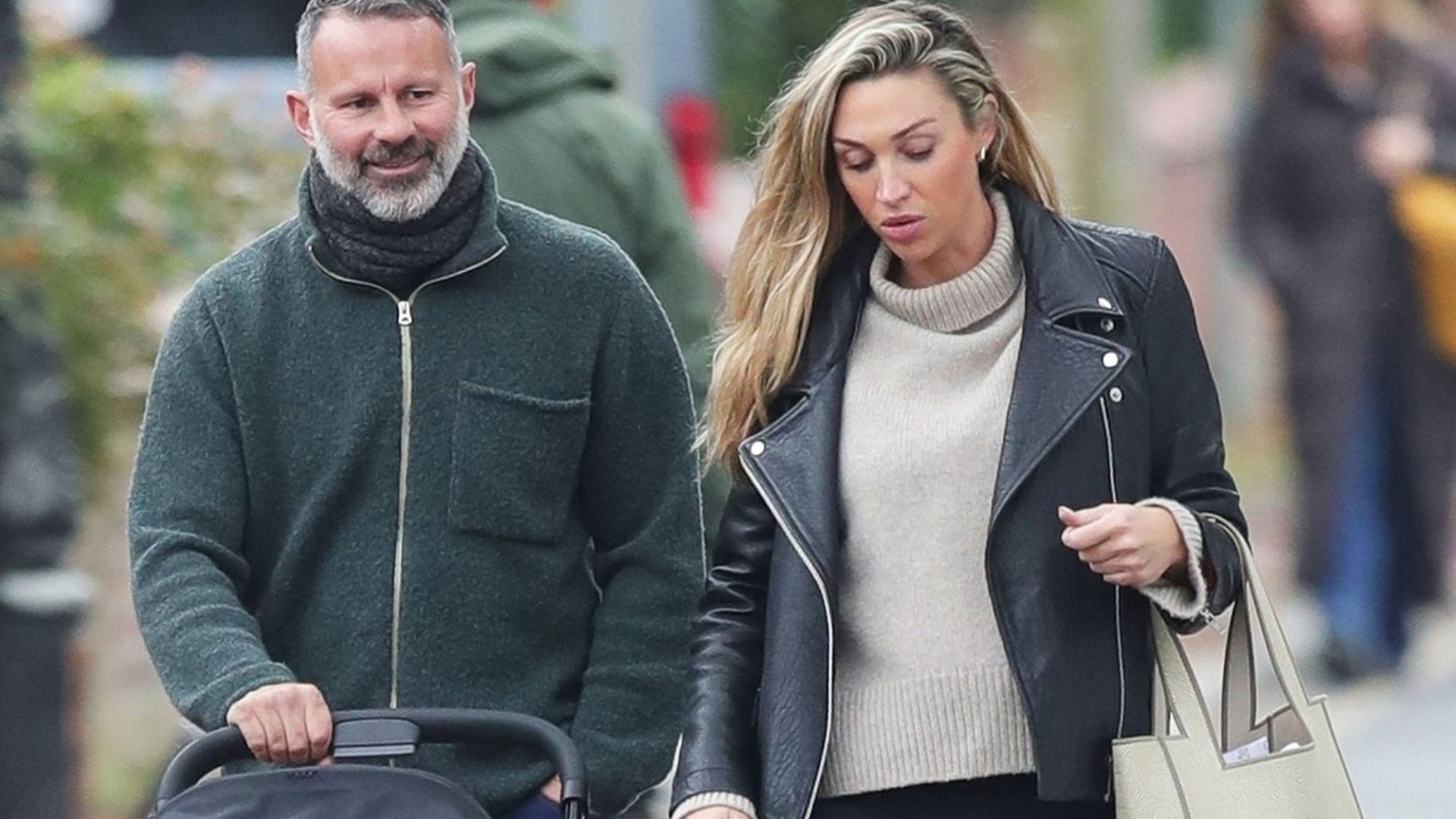 Ryan Giggs, 50, beams as he pushes new baby girl in pram alongside girlfriend Zara Charles, 36