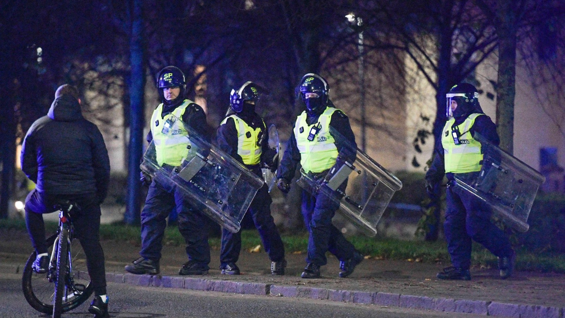 Moment riot cops clash with yobs in Edinburgh as gangs torch bins after launching fireworks at police