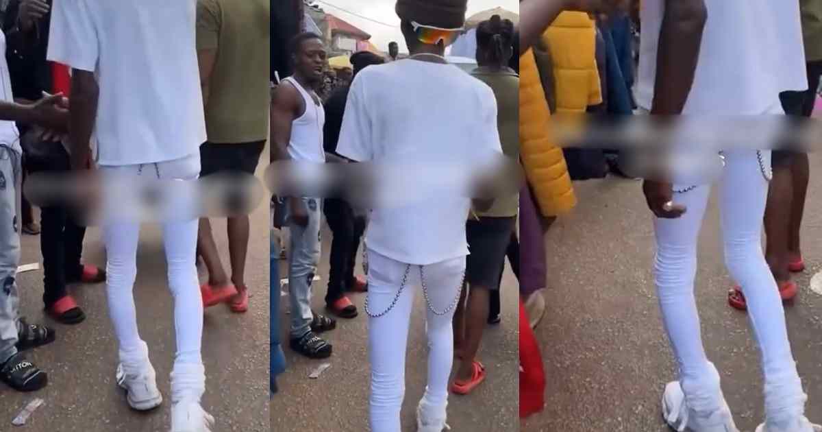 "how did he even put them on" – Man Turns Heads As He Rocks White Skinny Jeans Confidently At A Local Market (WATCH)