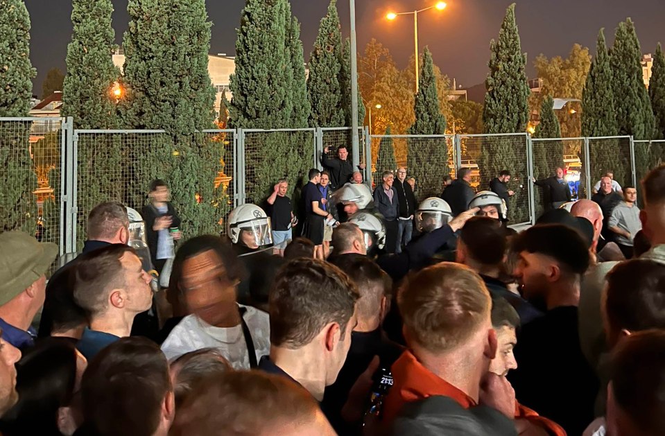 Riot cops met England fans outside Athens Olympic Stadium on Thursday night