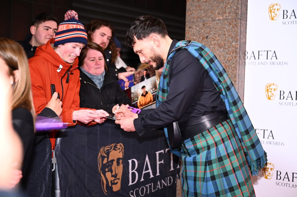 Gadd signed autographs and posed for selfies with fans outside the venue