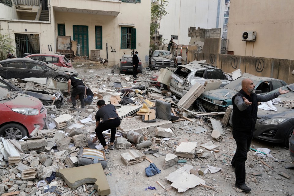 People search through the rubble of a destroyed building at the site of an Israeli airstrike in central Beirut’s Ras el-Nabaa neighborhood, Lebanon, Sunday, Nov. 17, 2024.(AP Photo/Bilal Hussein)