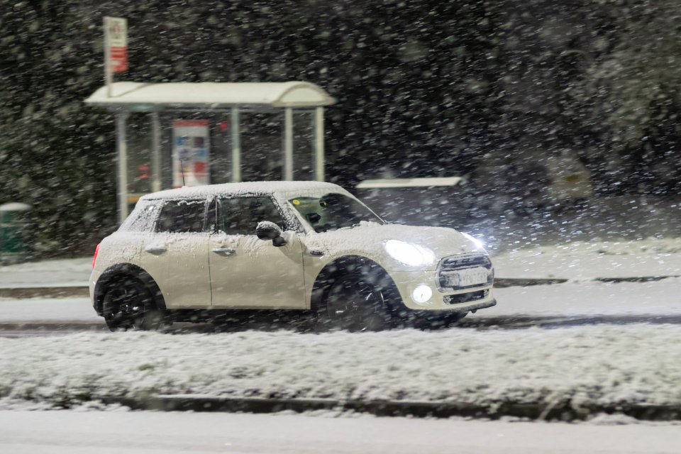 Cars battled through the snow in Cradley Heath, West Midlands