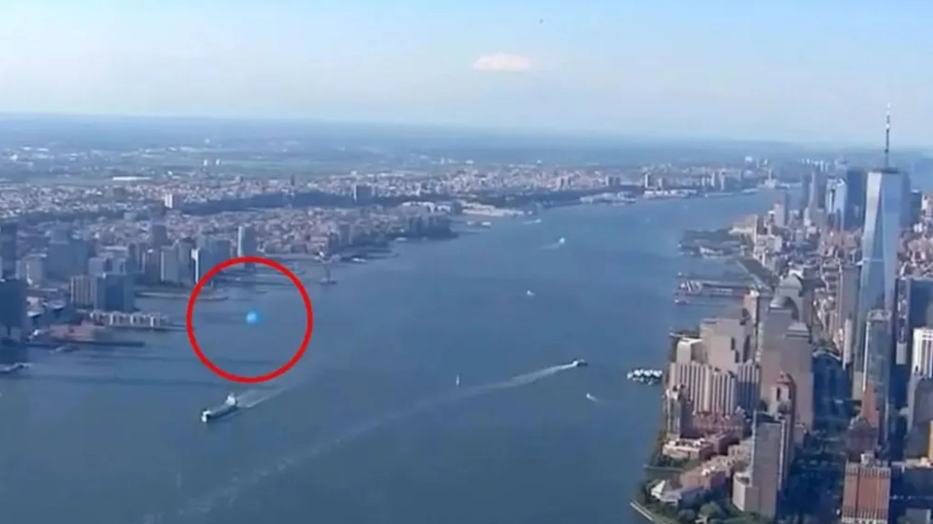 Eerie moment mysterious ‘UFO’ is caught on live TV as bizarre orb zooms past New York skyline in chopper cam footage