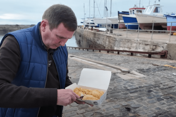 The YouTuber ordered a fish supper with a side of tartar sauce and mushy peas