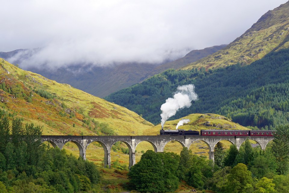 The train travels over the Glenfinnan Viaduct in the scene from the films