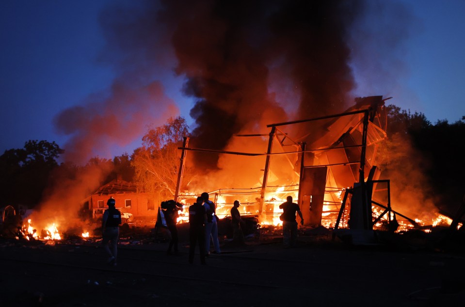 A building burns in Druzhkivka after a Russian bombing in June 2022