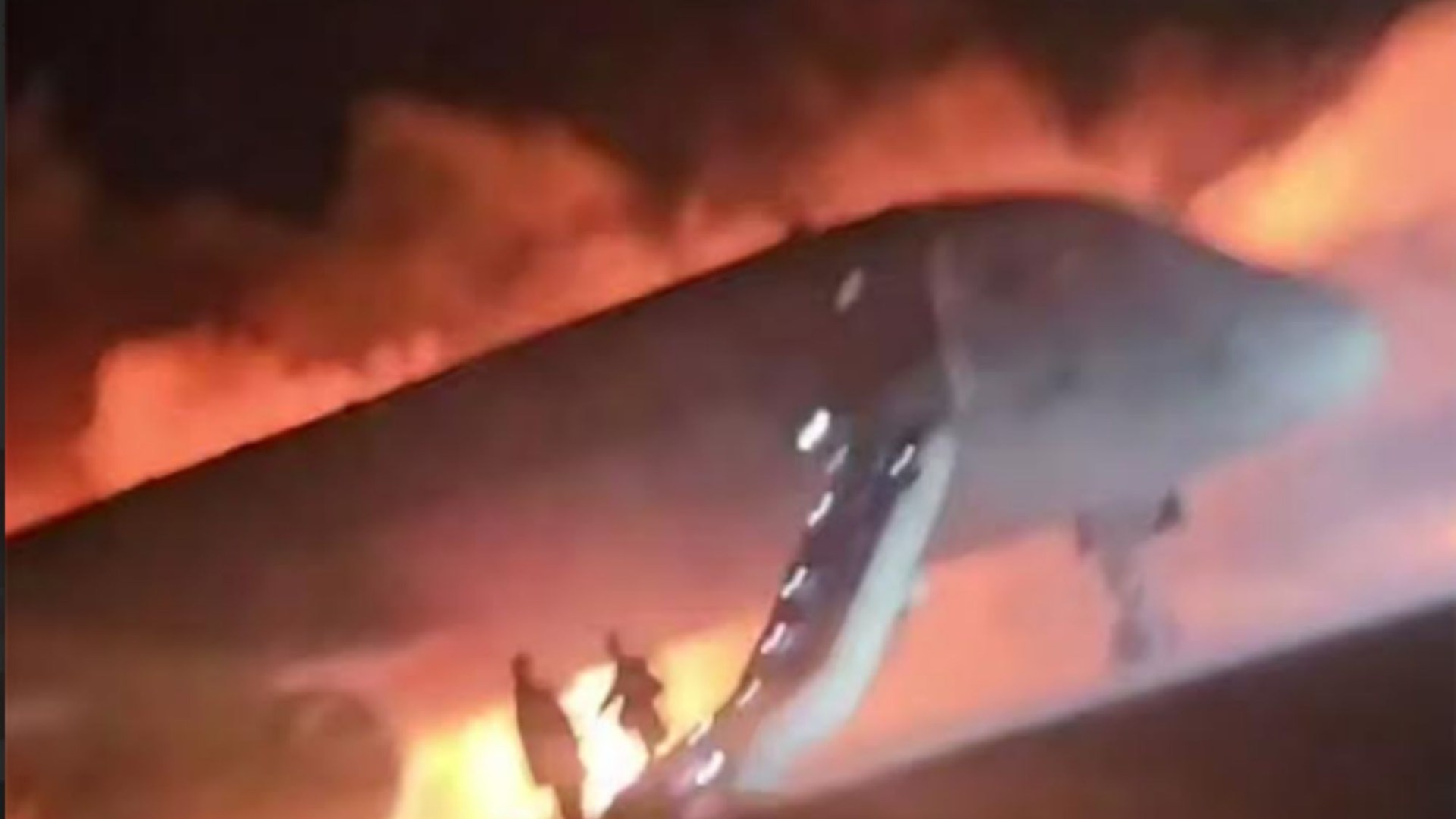 Terrifying moment plane goes up in flames after landing at Antalya airport as families escape down emergency slides