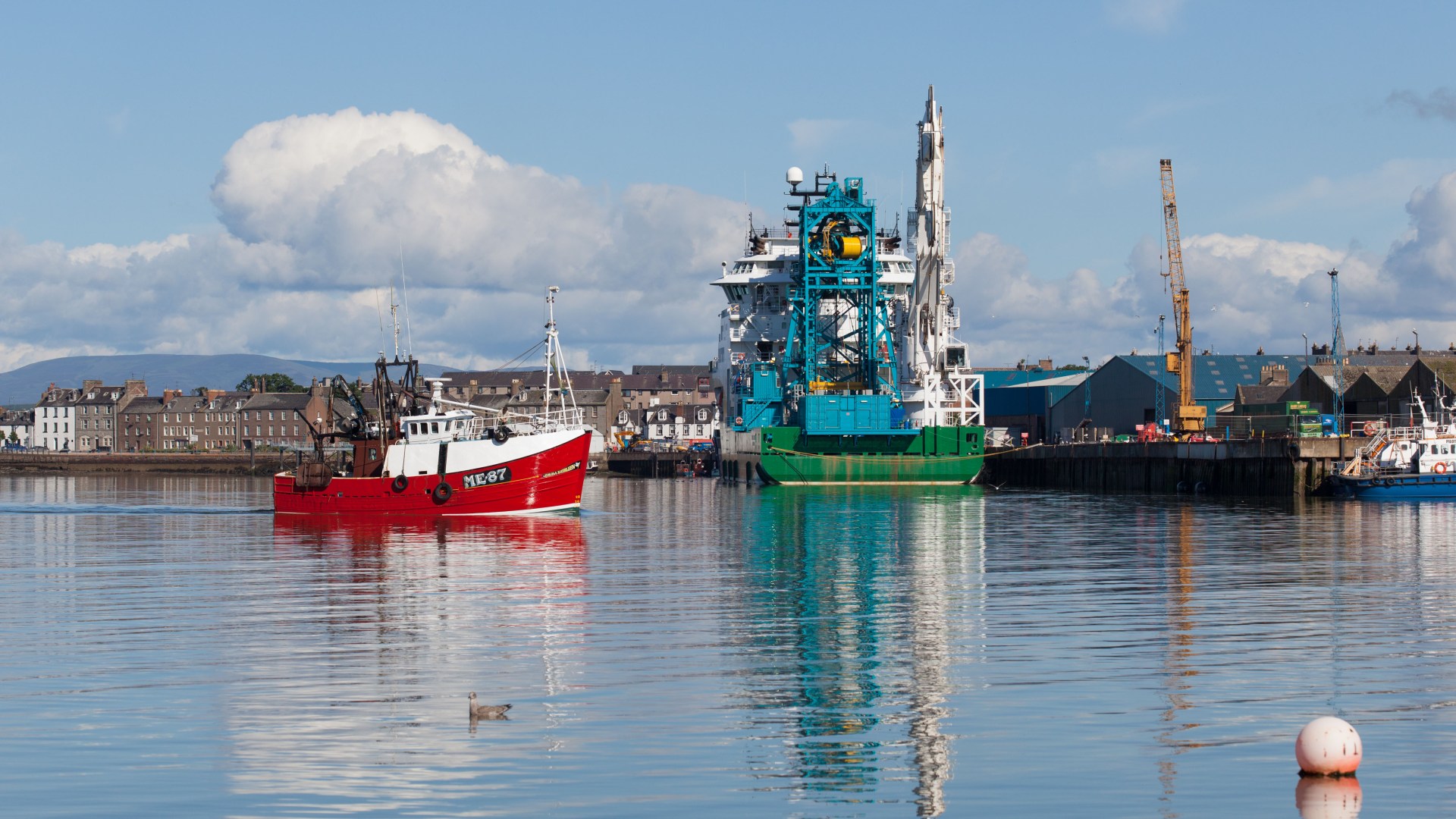 Hazmat-clad firefighters rush to Scots harbour after several people fall unwell