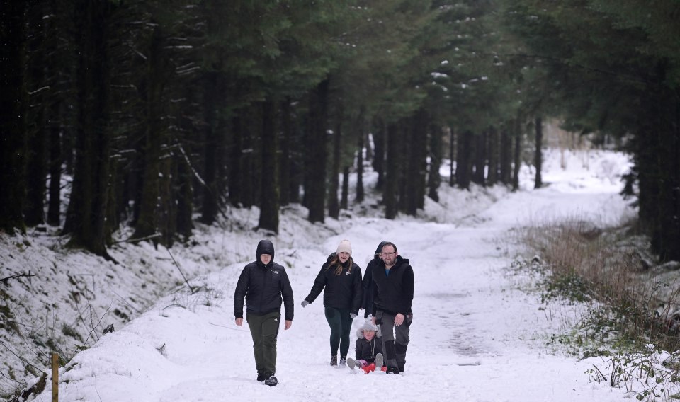 A family walking in Portstewart, Norther Ireland back in March