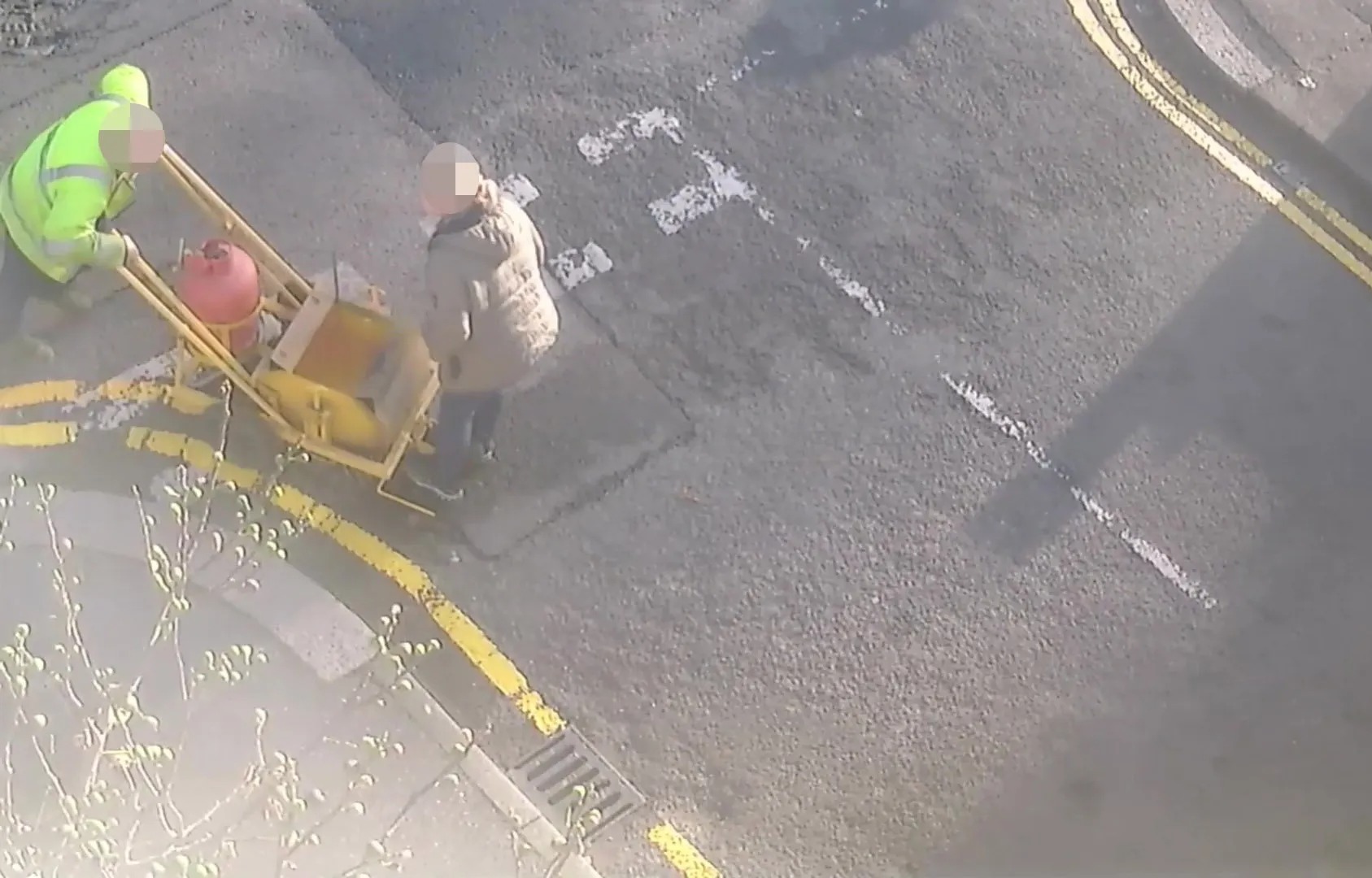 Moment council worker rams into woman trying to stop him painting double-yellow lines outside her home in furious row