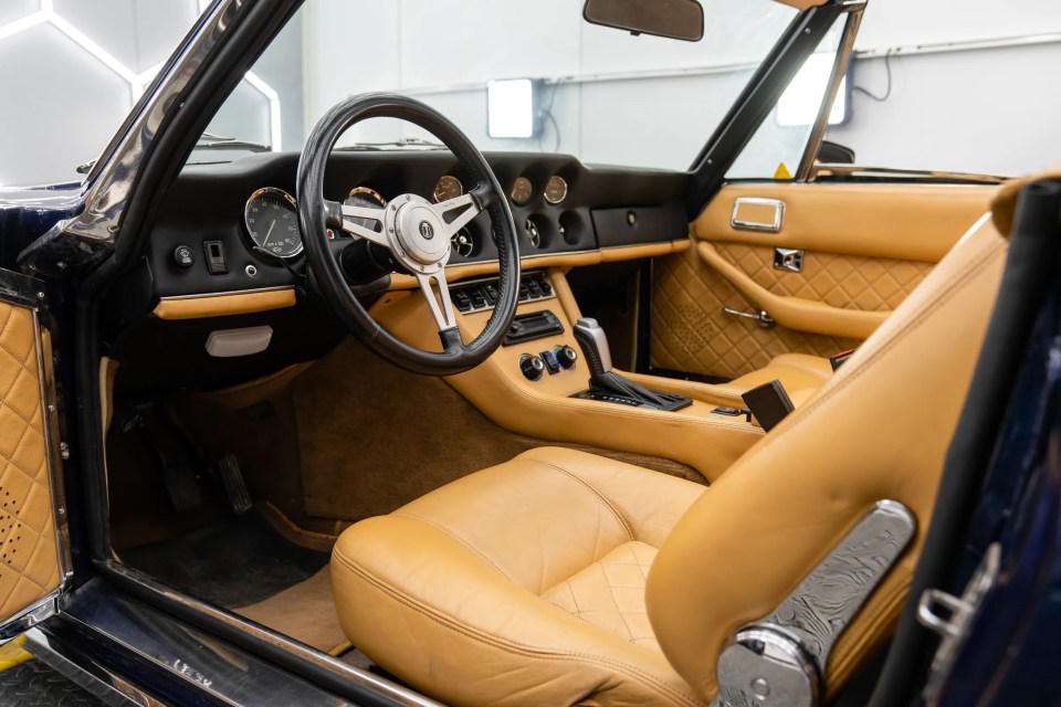 It features a tan interior