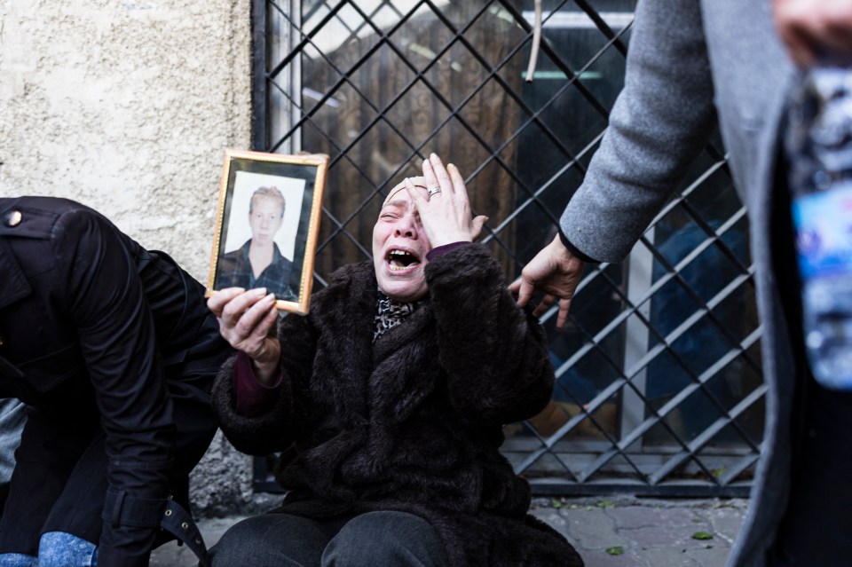 A Syrian woman, who lost two of her children, reacts as she couldn’t find the body of her third child