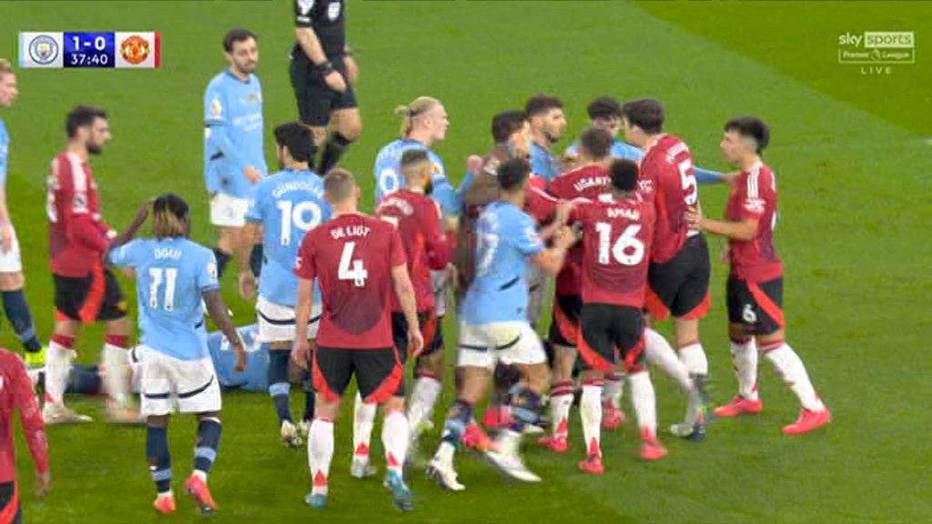 Fuming Harry Maguire confronts Kyle Walker in huge row as Man Utd's clash at Man City descends into chaos