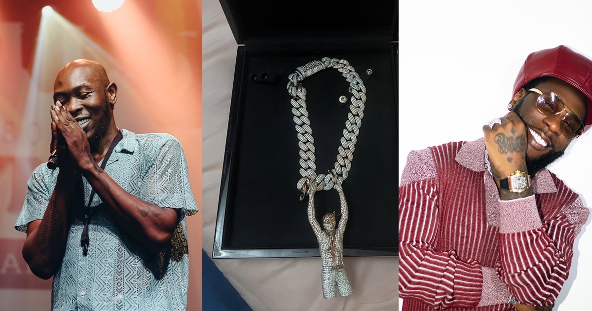 Burna Boy gifts Seun Kuti a custom necklace of his father, Fela Kuti, after their first official meeting (IMAGES)