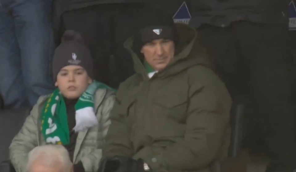 Joe Hart watched the game with his son as they wore Hoops scarves