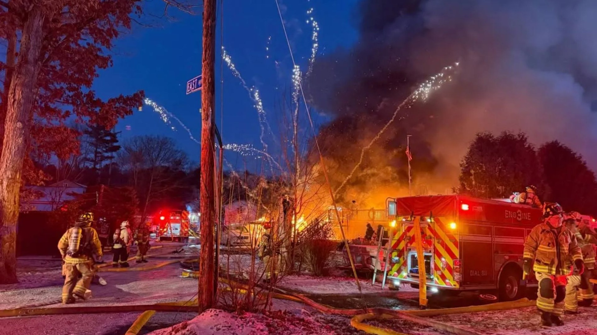 Terrifying moment barrage of fireworks launch from huge house blaze as firefighters battle inferno