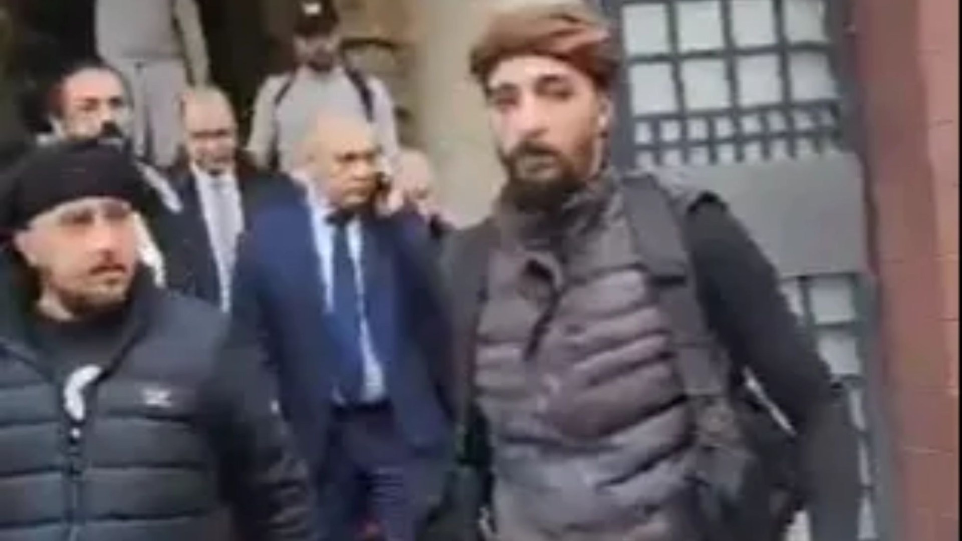 Watch as Syria's PM is frogmarched from his home by armed rebels to hand over power & fighters storm presidential palace