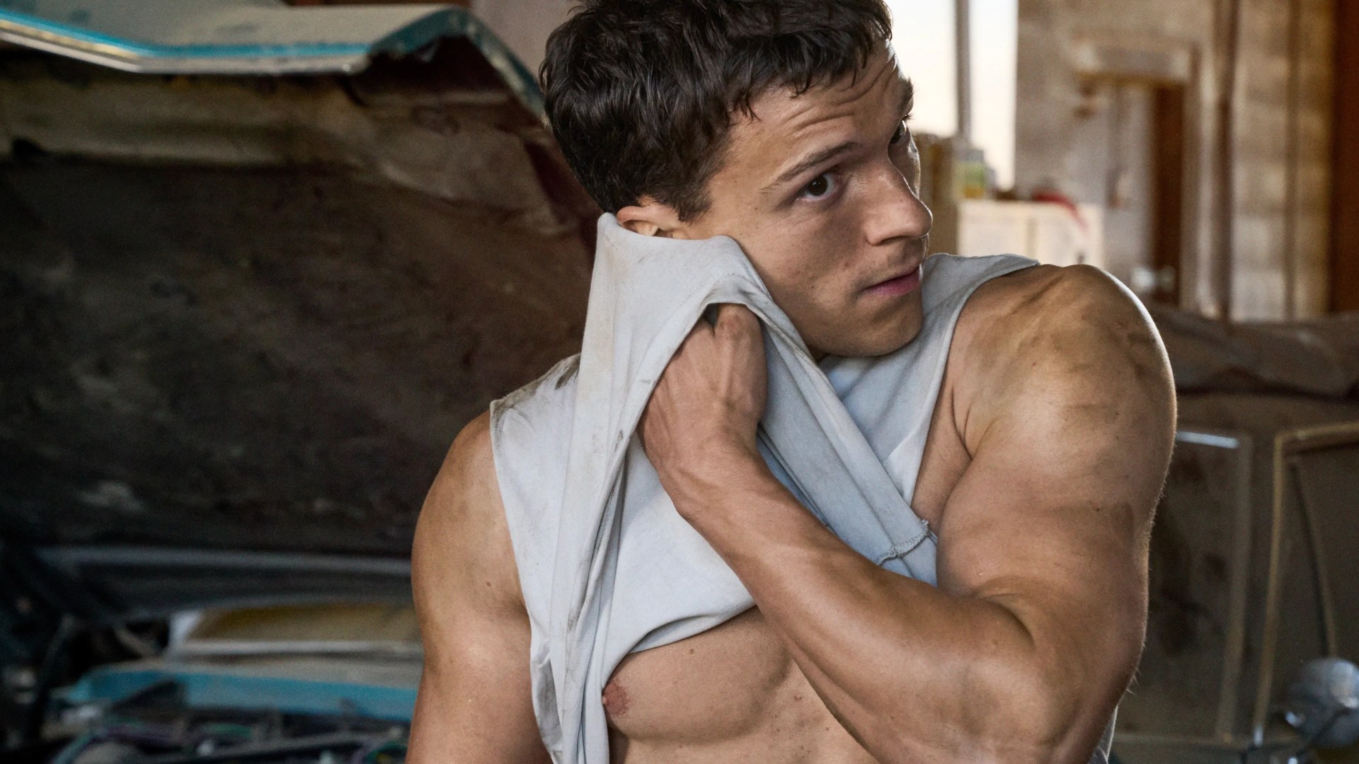 Tom Holland reveals when he's set to retire from acting as he flashes abs and biceps