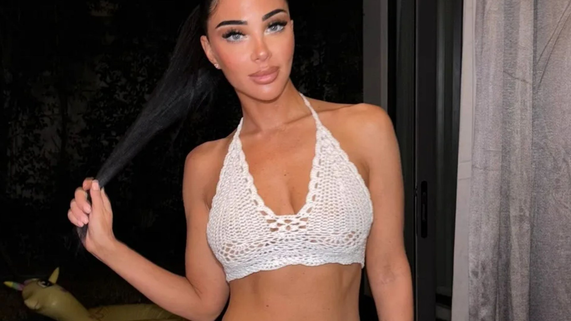 I'm A Celebrity's Tulisa shows off her ripped abs in a crocheted bralet and mini skirt on holiday in Thailand