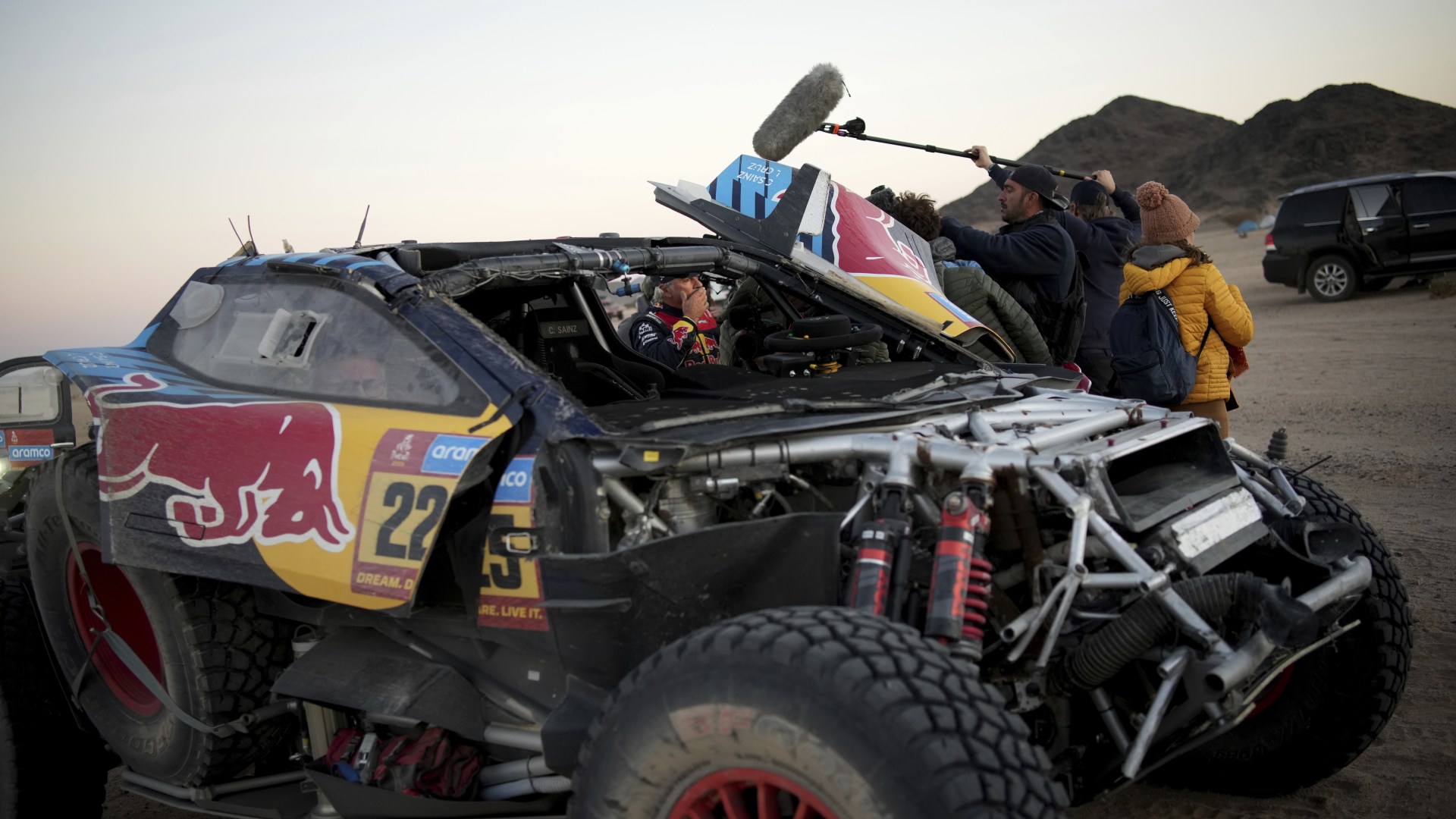 F1 star Carlos Sainz's dad, 61, rescued by team-mate after FLIPPING car during brutal Dakar Rally race