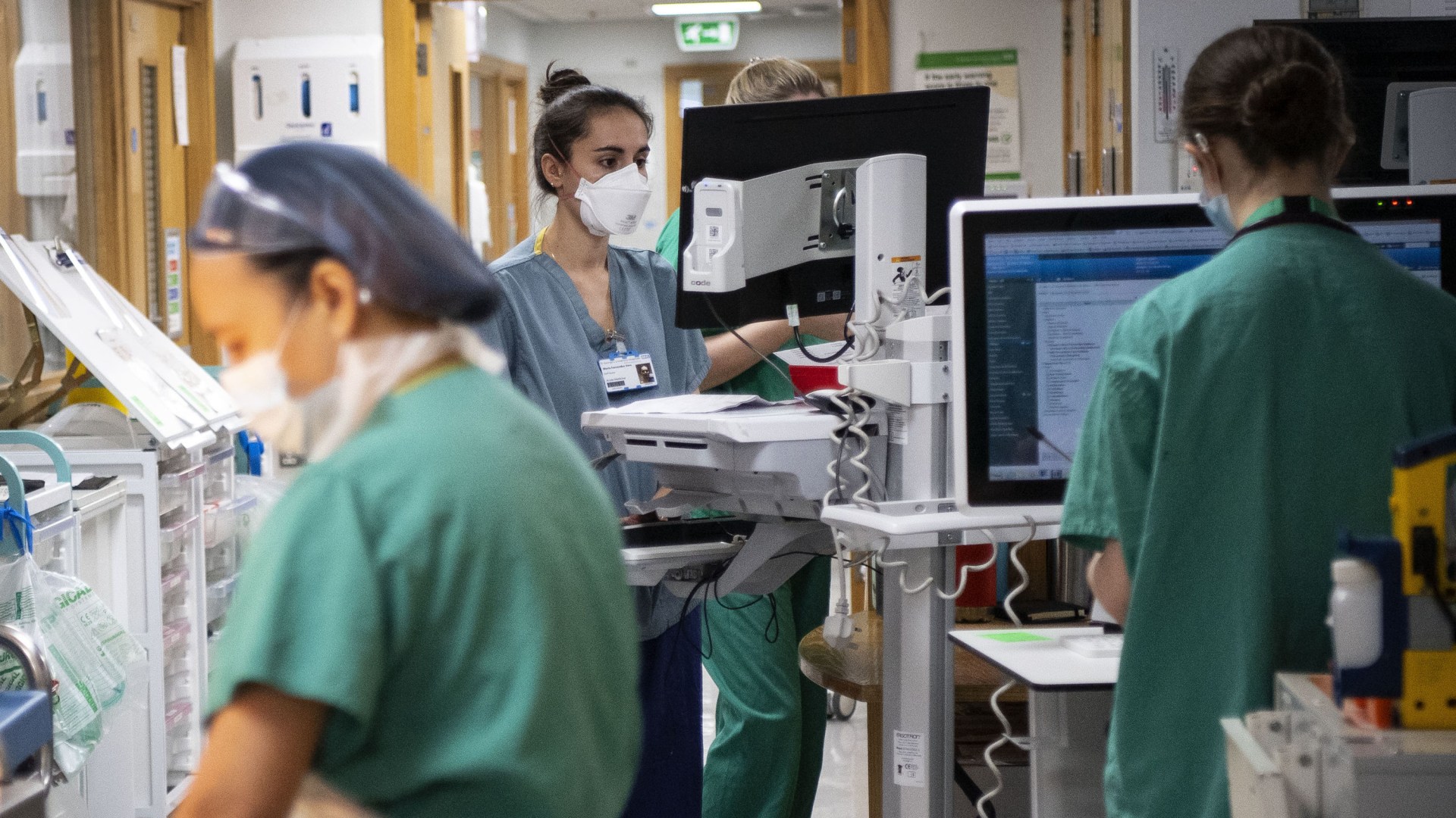 New 'corridor nurses' to care for sick patients waiting for hospital beds as NHS battles 'skyrocketing' flu case surge