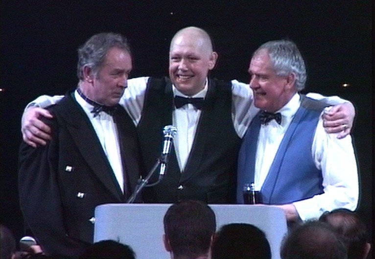 Gordon Brown with his brothers at a fundraising event.