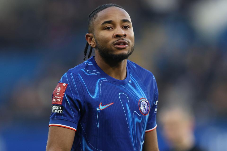 Christopher Nkunku of Chelsea in a blue jersey.