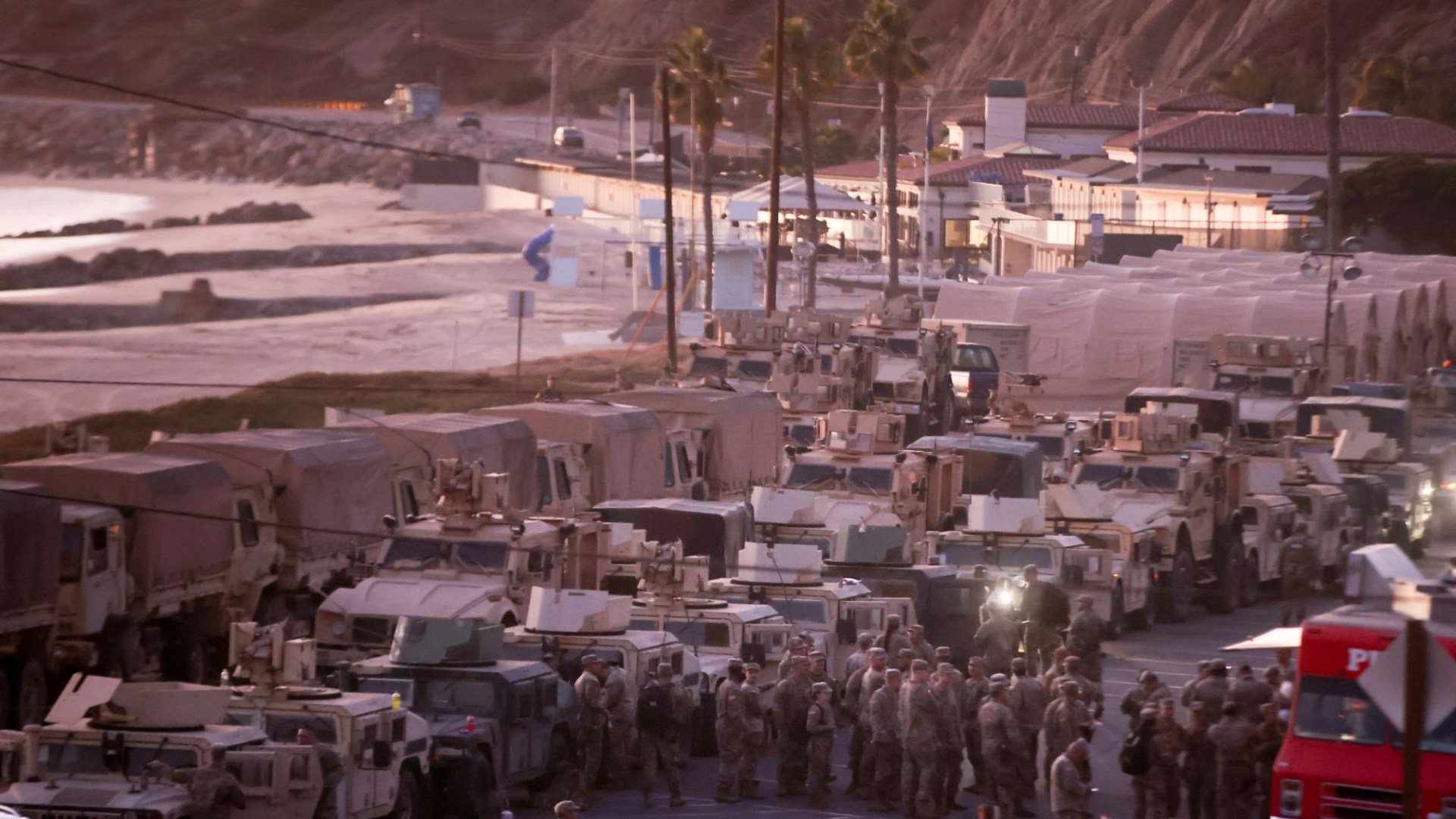 Over 2,500 soldiers sent to tackle LA’s fires and halt looting as they set up base on beach