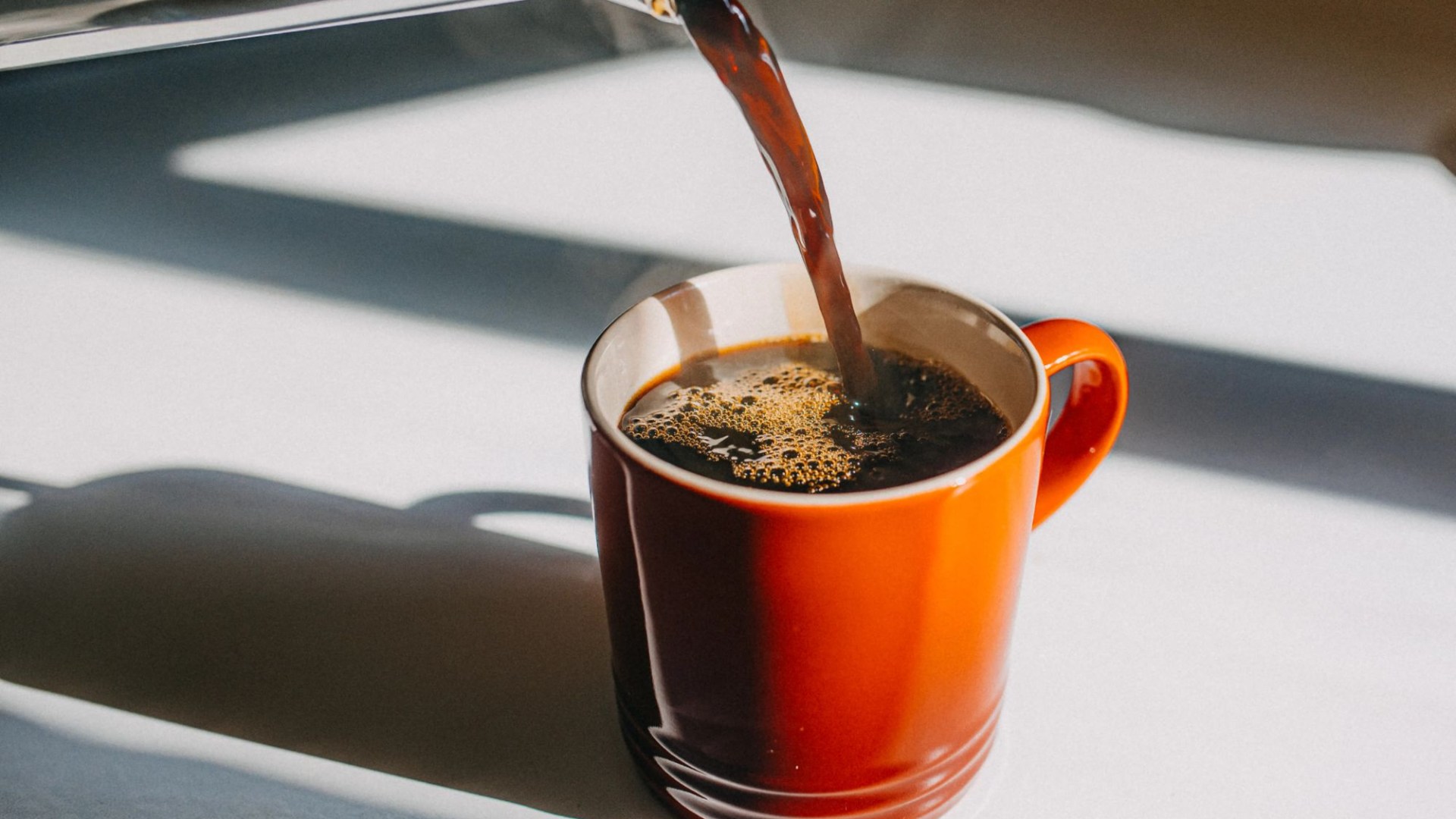 Heavy coffee drinking in later life could slash dementia risk - even with common heart problem, say scientists