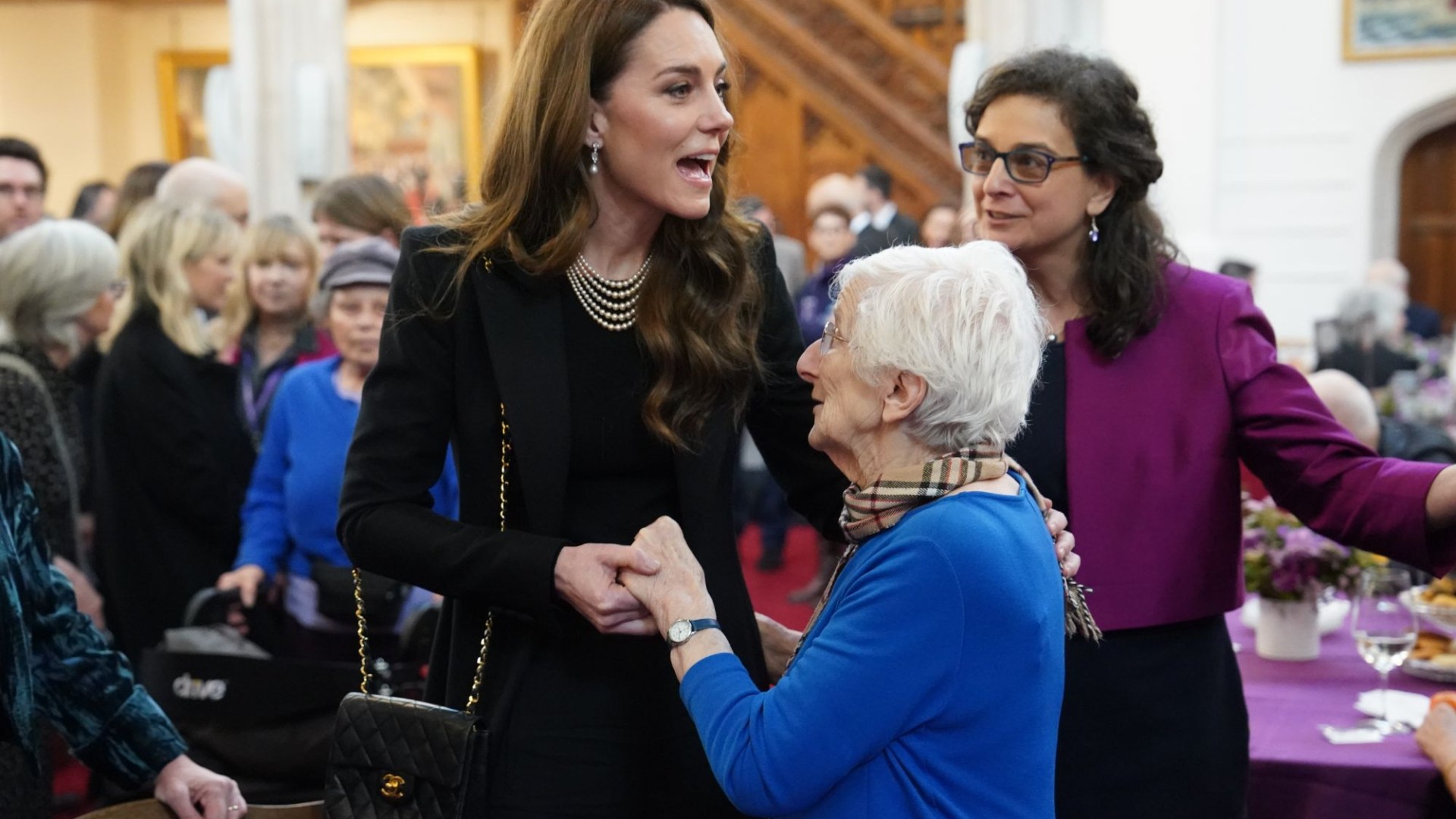 Kate hugs Holocaust survivors and lights candle at emotional memorial event and says 'it's good to be able to be here'