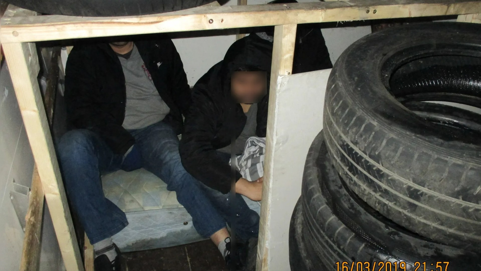 People smugglers JAILED after trying to sneak men into the UK crammed in makeshift den underneath pile of dirty tyres